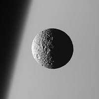 Cassini view of Mimas with Saturn in the background