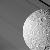 Cassini view of Mimas with Saturn's rings in the background