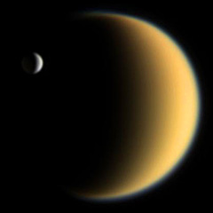 Cassini image of Titan with Enceladus in the foreground